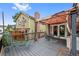 Relaxing deck featuring a sunshade and room to lounge and entertain guests outdoors at 18 Blue Sage, Littleton, CO 80127