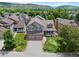 Beautiful two-story home featuring a well-manicured lawn, two-car garage and mountain views at 18 Blue Sage, Littleton, CO 80127