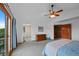 Spacious main bedroom with a private balcony and an ensuite bathroom at 18 Blue Sage, Littleton, CO 80127