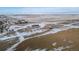 Aerial view of a property showcasing a house, outbuildings, and a wide open space at 4220 Headlight Rd, Strasburg, CO 80136