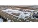 Aerial view of a house on a large lot with surrounding land at 4220 Headlight Rd, Strasburg, CO 80136