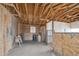 Interior of barn with stalls and tack at 4220 Headlight Rd, Strasburg, CO 80136