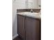 Simple bathroom with vanity, and dark brown cabinets at 4220 Headlight Rd, Strasburg, CO 80136