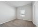 Simple bedroom with neutral decor and window with blinds at 4220 Headlight Rd, Strasburg, CO 80136