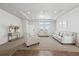 Bright and airy living room with neutral decor and hardwood floors at 4220 Headlight Rd, Strasburg, CO 80136