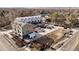 Aerial view of townhomes under construction, with visible parking and landscaping at 5193 Carr St, Arvada, CO 80002