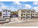 Newly constructed townhomes with modern exterior finishes and landscaping at 5193 Carr St, Arvada, CO 80002