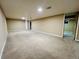 Unfinished basement with carpet, neutral walls, and recessed lighting offers flexible space for storage or recreation at 2027 S Newton St, Denver, CO 80219
