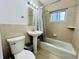 Cozy bathroom with a tub, sink, vanity mirror, and essential fixtures for daily convenience at 2027 S Newton St, Denver, CO 80219