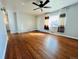 Inviting living room showcasing hardwood floors, a ceiling fan, and natural light at 2027 S Newton St, Denver, CO 80219