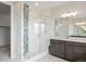 Bathroom with a glass-enclosed shower featuring white subway tile and decorative accent tile at 6405 Kenzie Cir, Castle Pines, CO 80108
