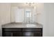 Bathroom boasts a granite countertop, undermount sink, and stylish lighting fixture at 6405 Kenzie Cir, Castle Pines, CO 80108