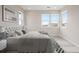 Well-lit bedroom featuring a comfortable bed, stylish decor, and scenic views at 6405 Kenzie Cir, Castle Pines, CO 80108