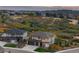 Beautiful two-story home with an attached three-car garage and a meticulously manicured lawn at 6405 Kenzie Cir, Castle Pines, CO 80108