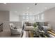 Upstairs living area featuring neutral tones, modern furniture, and bright light at 6405 Kenzie Cir, Castle Pines, CO 80108