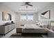 Spacious primary bedroom with large windows, elegant furnishings, and stylish decor create a tranquil retreat at 6405 Kenzie Cir, Castle Pines, CO 80108