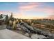 Enjoy the calming sounds of this beautiful water feature with lush landscaping and a serene view at 6405 Kenzie Cir, Castle Pines, CO 80108