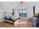 Spacious bedroom with hardwood floors, natural light and mountain views at 7868 Cicero Ct, Littleton, CO 80125