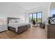 Sun-filled bedroom with a large window, hardwood floors, and a private work space at 7868 Cicero Ct, Littleton, CO 80125