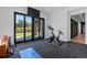 Well-lit exercise room with large windows, perfect for working out at home at 7868 Cicero Ct, Littleton, CO 80125
