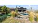 Beautiful home featuring manicured lawns, a putting green, and a sparkling pool with mature landscaping at 7868 Cicero Ct, Littleton, CO 80125