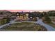 Attractive home with a circular driveway, lush landscaping, and mountain views at 7868 Cicero Ct, Littleton, CO 80125