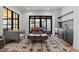 Cozy living area with hardwood floors, modern furniture, and a wet bar, creating an inviting space at 7868 Cicero Ct, Littleton, CO 80125
