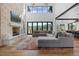 Cozy living room with stone fireplace, large windows, and comfortable seating for relaxing and entertaining at 7868 Cicero Ct, Littleton, CO 80125