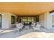 Spacious covered patio with ample seating, ideal for entertaining and enjoying the outdoor scenery at 7868 Cicero Ct, Littleton, CO 80125