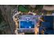 Aerial view of a luxurious pool with a waterfall feature, stone paths, and a putting green at 7868 Cicero Ct, Littleton, CO 80125