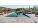Featuring a pool, lounge chairs, and stone accents at 7868 Cicero Ct, Littleton, CO 80125