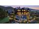 Home featuring a pool, putting green and other well manicured landscaping at 7868 Cicero Ct, Littleton, CO 80125