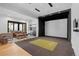 Spacious recreation room with a projector screen and wet bar, perfect for entertaining guests and relaxing at 7868 Cicero Ct, Littleton, CO 80125