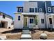 Charming two-story home with a welcoming front porch and professionally landscaped front yard at 6648 N Nepal Ct, Aurora, CO 80019