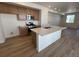 Updated kitchen featuring a kitchen island, stainless steel appliances, and ample cabinet space at 6648 N Nepal Ct, Aurora, CO 80019