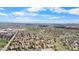 Scenic aerial view of a neighborhood featuring abundant trees, parks, and walking trails under a bright sky at 7355 S Knolls Way, Centennial, CO 80122