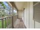 Spacious balcony with wood flooring, view of the green space and shade trees at 7355 S Knolls Way, Centennial, CO 80122
