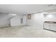 Open basement layout with staircase, wet bar, and ample space offers flexible living and storage options at 7355 S Knolls Way, Centennial, CO 80122