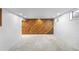 Spacious room with wood accent wall and neutral carpet flooring, perfect for various uses and personalization at 7355 S Knolls Way, Centennial, CO 80122