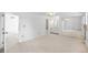 Large bedroom with white walls and carpet, access to ensuite bath and mirrored closet at 7355 S Knolls Way, Centennial, CO 80122