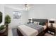 Bedroom featuring a bed with sleek gray accents and lots of natural light from the window at 7355 S Knolls Way, Centennial, CO 80122