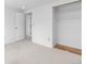 Bedroom featuring a small closet and an open door to the hallway, bathed in bright light at 7355 S Knolls Way, Centennial, CO 80122