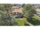 Charming brick townhome with a second-story balcony surrounded by mature trees at 7355 S Knolls Way, Centennial, CO 80122