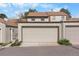 Attached garage for convenient parking and storage with low maintenance landscaping at 7355 S Knolls Way, Centennial, CO 80122