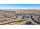 A distant aerial shot showing the community, a body of water, and a golf course at 7680 S Blackstone Pkwy, Aurora, CO 80016
