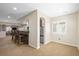 Basement area features a bar, refrigerator, and windows for natural light at 7680 S Blackstone Pkwy, Aurora, CO 80016
