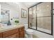 Well-lit bathroom features a shower and bathtub combination with tile surround at 7680 S Blackstone Pkwy, Aurora, CO 80016