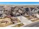 Lovely two-story home with a charming front porch, landscaped yard, and convenient two car garage at 7680 S Blackstone Pkwy, Aurora, CO 80016