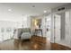 Open hallway with hardwood floors and a chair in a modern color palette at 7680 S Blackstone Pkwy, Aurora, CO 80016