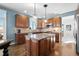 Open concept kitchen with island, stainless steel appliances and granite countertops at 7680 S Blackstone Pkwy, Aurora, CO 80016